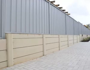 Smooth Cream Concrete Wall with Fencing | Retaining Wall Supplies Melbourne
