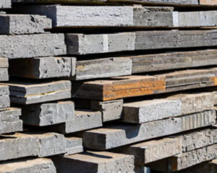 Stacked concrete slabs ready for recycling or disposal.